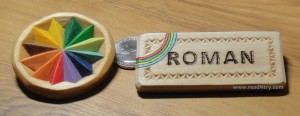 Chip carving examples: photo of a small chip carved rosette and a chip carved name badge.