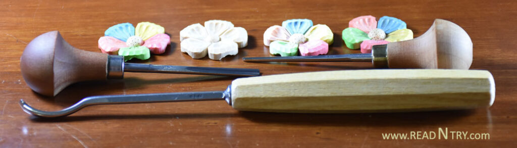 Tools to carve flowers: two gouges and a V-tool.