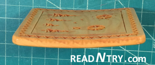 Example of a basswood chip carved coaster affected by the board warping. The thin board cupped.