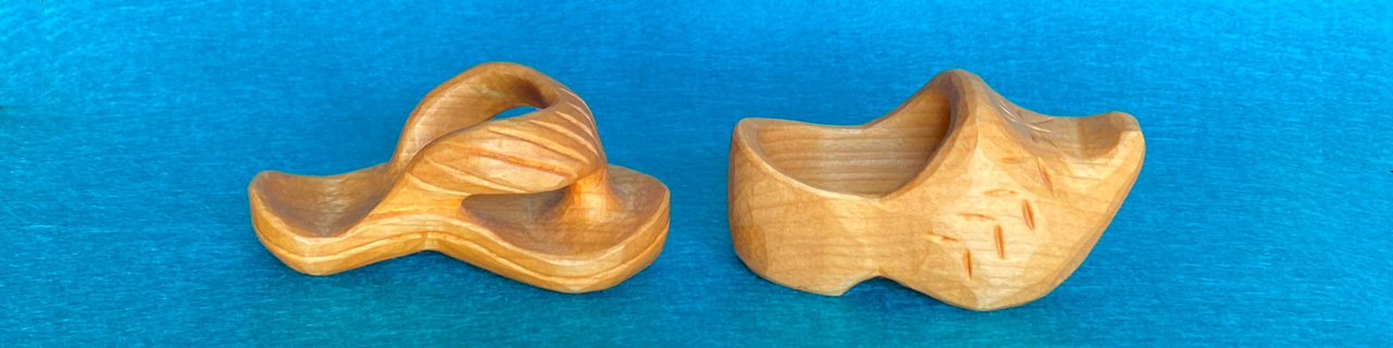 Carved Wooden Shoes: a flip-flop and a clog