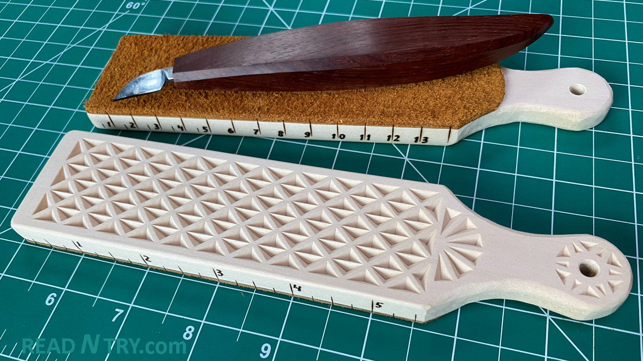 Two chip carved strops and a chip carving knife. These DIY strops have ruler marks on the sides. One strop with inches and the other with centimeters.
