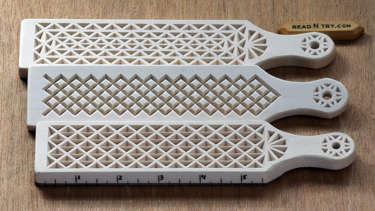 Three leather strops, each carved with a unique chip carving design. Ruler measurement marks are woodburned into the side of the DIY strops to expand their functionality. The chip carving patterns for those strops are available for free download at READ N TRY: https://readntry.com