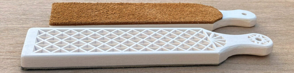 Two DIY strops with a simple chip-carving pattern on one side and leather on the other. The strops are made from 3/8" basswood board by Roman Chernikov.