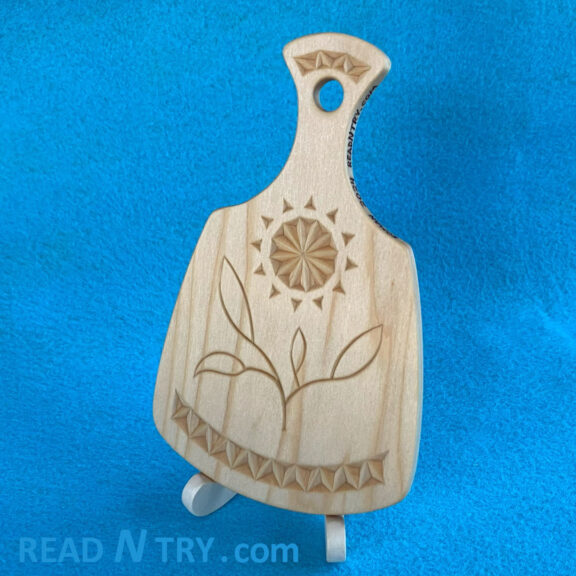 The serving board on a small easel.