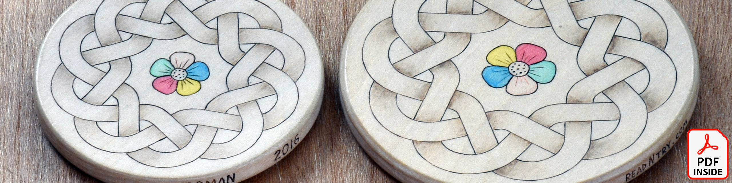 A round Celtic knot pattern woodburned on the surfaces of two wooden coasters. A colorful flower is burned and painted in the center.