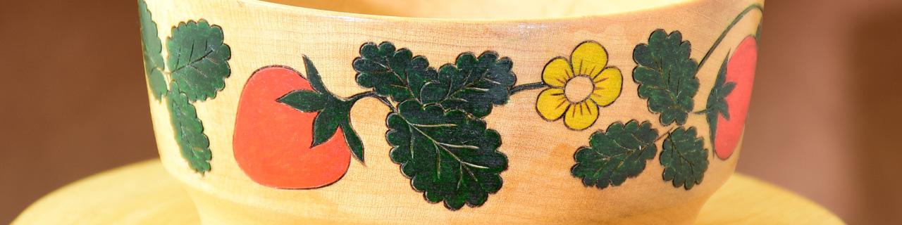 Strawberries outlined with a woodburner and painted on a turned bowl.