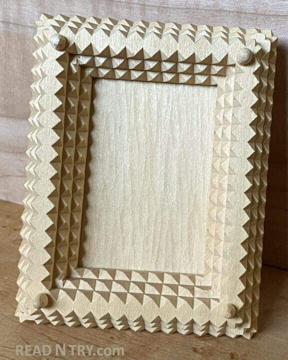 A Tramp Art picture frame without a picture.