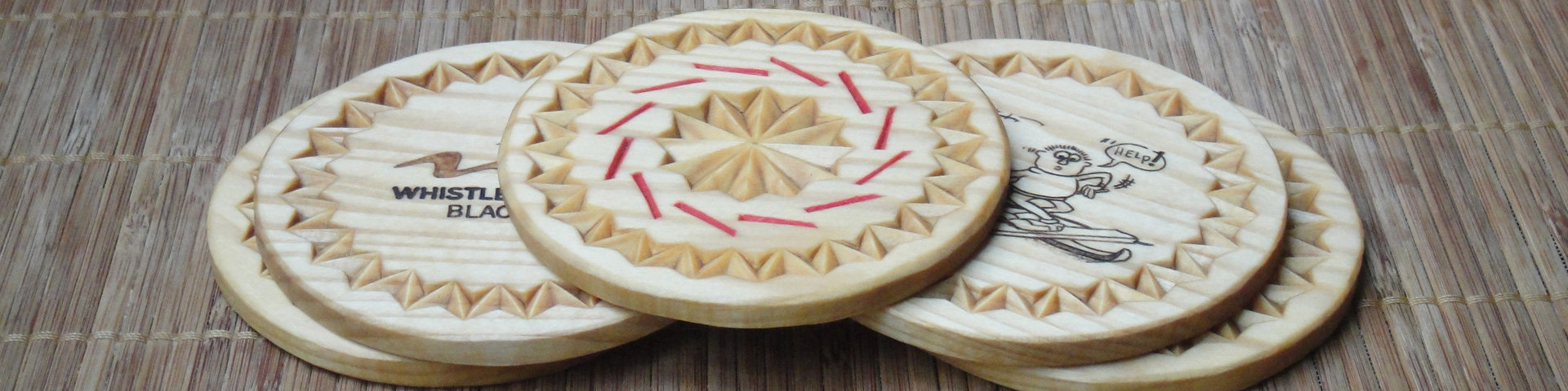 A chip carving coaster set consists of five coasters, shown overlapping one another.